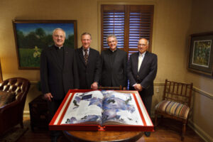 On hand for the presentation of The Saint John's Bible Heritage edition Aug. 27 were, left to right: St. Thomas president Father Dennis Dease; St. Thomas trustee Robert Ulrich, former chairman and chief executive officer of Target Corp.; Father Robert Koopmann, president of St. John's University; and John Pellegrene, retired executive vice president of marketing for Target Corp.  
