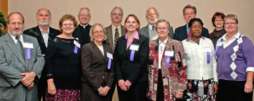 Quarter Century Club inductees: Top row, from left to right: Tom Hodgson, Father Dennis Dease, president of the university, Don LaMagdeleine, Tom Mega, Tony Erickson and MaryLou Schmidt. Bottom row: Jerry Schwartz, Jeanne Buckeye, Brenda Powell, Janet Gould, Sister Paul Therese Saiko, Theresa Namusisi and Gayle Lamb. Not pictured: Linda Halverson, Helen Hunter, Marcos Macias, Richard Schuler, Glenn Sherer, Jane Spatenka, Roger Stowell and and Heekyung Youn.