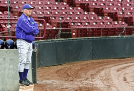 The coach, the leader, Dennis Denning surveys the scene of another Tommie basebal triumph.