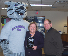 Dede Hering was presented the Acts of Kindness Award for January by Father Erich Rutten and Tommie. 