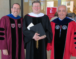 New honorary degree recipient Father Jan Michael Joncas, center, with Provost Thomas Forget (left) and President Anthony Cernera of Sacred Heart University.