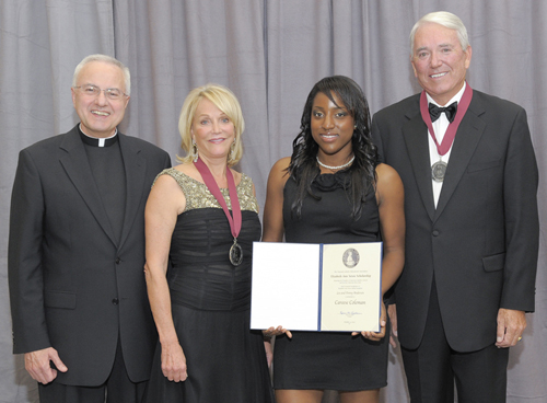 Lee and Penny Anderson received a Saint Elizabeth Ann Seton Award from the National Catholic Education Association. Father Dennis Dease, president of St. Thomas, and Careese Coleman, a St. Thomas sophomore who received a scholarship in the Andersons’ name, also attended the event.