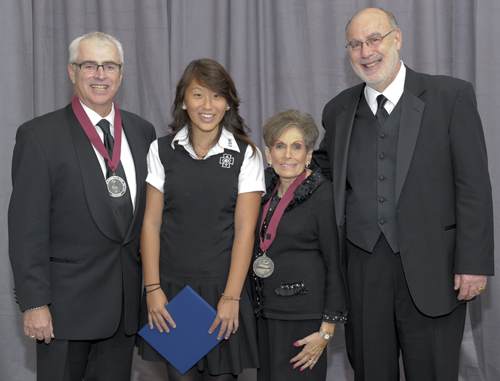 Frank (left) and Judy Sunberg received a Saint Elizabeth Ann Seton Award from the National Catholic Education Association. Richard Engler (right), president and principal of Cretin-Derham Hall, and Fayte Moua, a Cretin-Derham senior who received a received a NCEA scholarship in the Sunbergs’ name, also attended the event.
