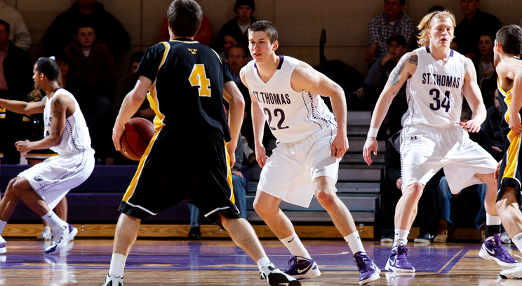 Noah Kaiser (seen here against Gustavus in the MIAC men's basketball championship game) hit a 3-point shot late in the game against Wheaton to put the Tommies ahead for good 63-62. The Tommies travel to Salem, Va., to play in the Elite Eight.