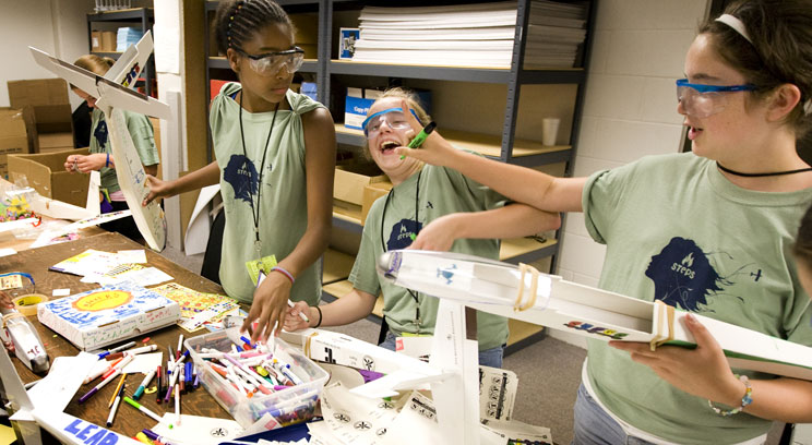 From the left, Jayla Mayes-Jackson, Kaitlin Nix and Katie Bruce have fun while building airplanes at an earlier STEPS camp (St. Thomas photo by Mike Ekern).