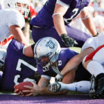 Running back Ben Wartman appeared to cross into the end zone in 2008, but game officials did not call it a score. The Tommies fumbled on the next play and Saint John's would go on to win 9-12. The losing streak would continue. (Photo by Mike Ekern '02)