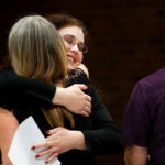 Graduate music students get hugs and program diplomas during an Orff Schulwerk performance in Brady Educational Center auditorium August 12, 2011.