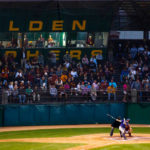 Dan Reichert bats during the last baseball game at the University of Minnesota's Seibert Field May 1. The field is slated to be replaced by a new facility. (Photo by Mike Ekern '02)