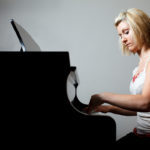 Undergrad Kelli Hudson plays piano. (Photo by Mark Brown)
