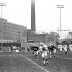 Some things, like a campus under construction, never change. Here in the background of the 1969 game, O'Shaughnessy Educational Center is being built. The Tommies lost 11-33.