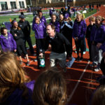 Women's track and field head coach Joe Sweeney exults in victory while holding his team's first place plaque following the women's MIAC outdoor track and field championship finals May 11, 2013. (Photo by Mike Ekern '02)
