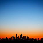 The Minneapolis skyline is seen at sunset from the roof of the Anderson Student Center. (Photo by Mike Ekern '02)