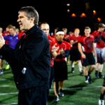 SJV rector Fr. Michael Becker claps for his team. (Photo by Mike Ekern '02)