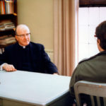 Father Lavin with a student.