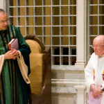 Father Dennis Dease (left) and Monsignor James Lavin during an alumni homecoming mass October 14, 2006 in the Chapel of St. Thomas Aquinas.