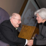 Lavin shakes hands with Arlene Leyden during his 90th birthday celebration November 14, 2008.