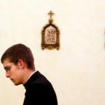 St. John Vianney seminarian Jason LaPaglia prays in the Bernardi chapel. (Mike Ekern/University of St. Thomas)