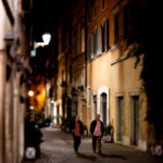 Men walk along a Roman street at night.  (Mike Ekern/University of St. Thomas)