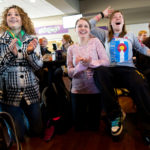 Students, from left, Olivia Bennett, Andrea Diamond and Laurel Eyer react as they watch the announcement of a new pope in Scooter’s March 13. (Photo by Mark Brown)