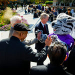 Tommie the mascot greets people on the John P. Monahan Plaza during the community lunch prior to the inauguration. (Photo by Mark Brown)