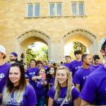 Students processed under The Arches and across the lower quad. (Photo by Mark Brown)