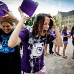 Students Jenny Murtha (right) and Sarah Rae LaValla douse themselves with ice water as part of UST's mass "Ice Bucket Challenge."