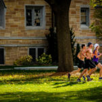 Student runners cross the lower quad. (Photo by Mark Brown)