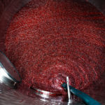 Grapes are pumped into a fermenting tank.