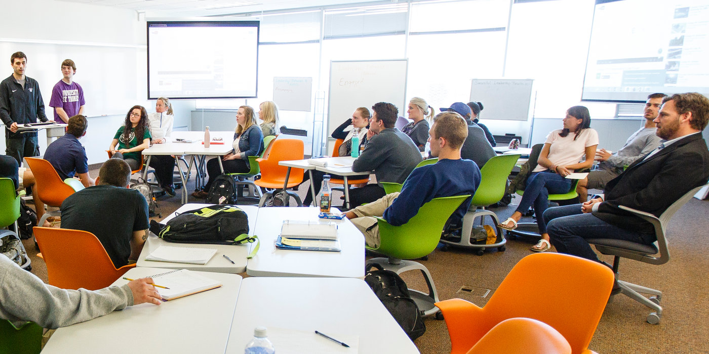 Students give presentations in Professor Alec Johnson's Foundations of Entrepreneurship class in a "smart classroom" in Schulze Hall 420 in downtown Minneapolis on April 14, 2015.