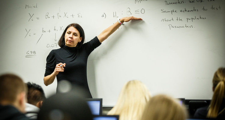 Economics Professor Luz Saavedra teaches an Economics Forecasting class in an O'Shaughnessy Educational Center classroom on April 15, 2014. These images were taken for a College of Arts and Sciences brochure.