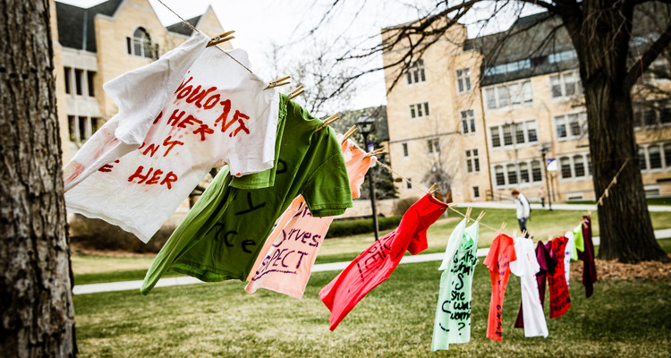 T-shirts representing women affected by sexual assault or violence hang from a line in the lower quad April 21, 2015. The "Clothesline Project" display was part of a week-long collection of activities meant to highlight and combat rape culture on college campuses. The display was put on by student group Feminist Community (FemCom), a group run out of the Luann Dummer Center for Women.