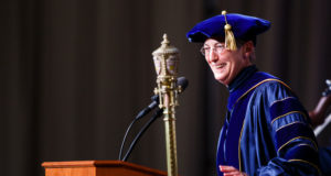 Opus College of Business Dean Stefanie Lenway speaks during the graduate business commencement ceremony May 23, 2015 in the Anderson Athletic and Recreation Complex Field House.