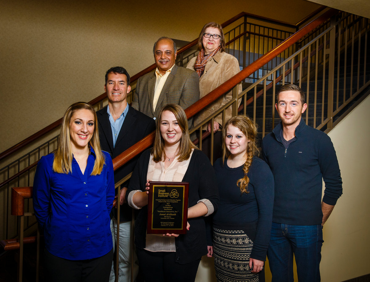 St. Thomas Opus College of Business undergraduate students pose with their first place plaque from the national Small Business Institute competition. Their project was "Healthcare Interactive, Inc." Front row from left: Payton burger, Hilary Cotter, Betsy Reed, Cole Aden. Back row from left: Team sponsor John Hobaday, SBI director and OCB professor Jamal Al-Khatib, OCB assistant director of undergraduate programs Jean Gabler.