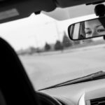 Alejandra Chavez Rivas is reflected in her rearview mirror. Chavez Rivas was profiled by St. Thomas magazine.