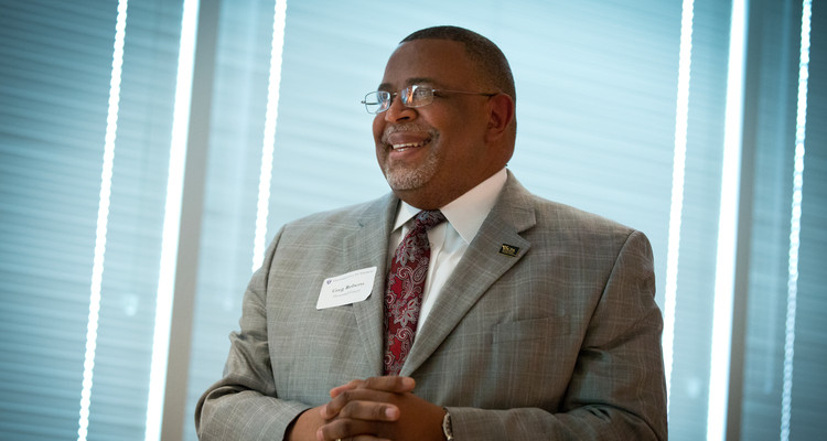 Greg Roberts, former vice president of Student Affairs, listens to a speaker at a 10-year anniversary party for the College of Education, Leadership and Counseling's Leadership in Student Affairs program in Opus Hall on the Minneapolis campus on June 6, 2013. Roberts was given and honorary award at the event in recognition of his past service to the program.