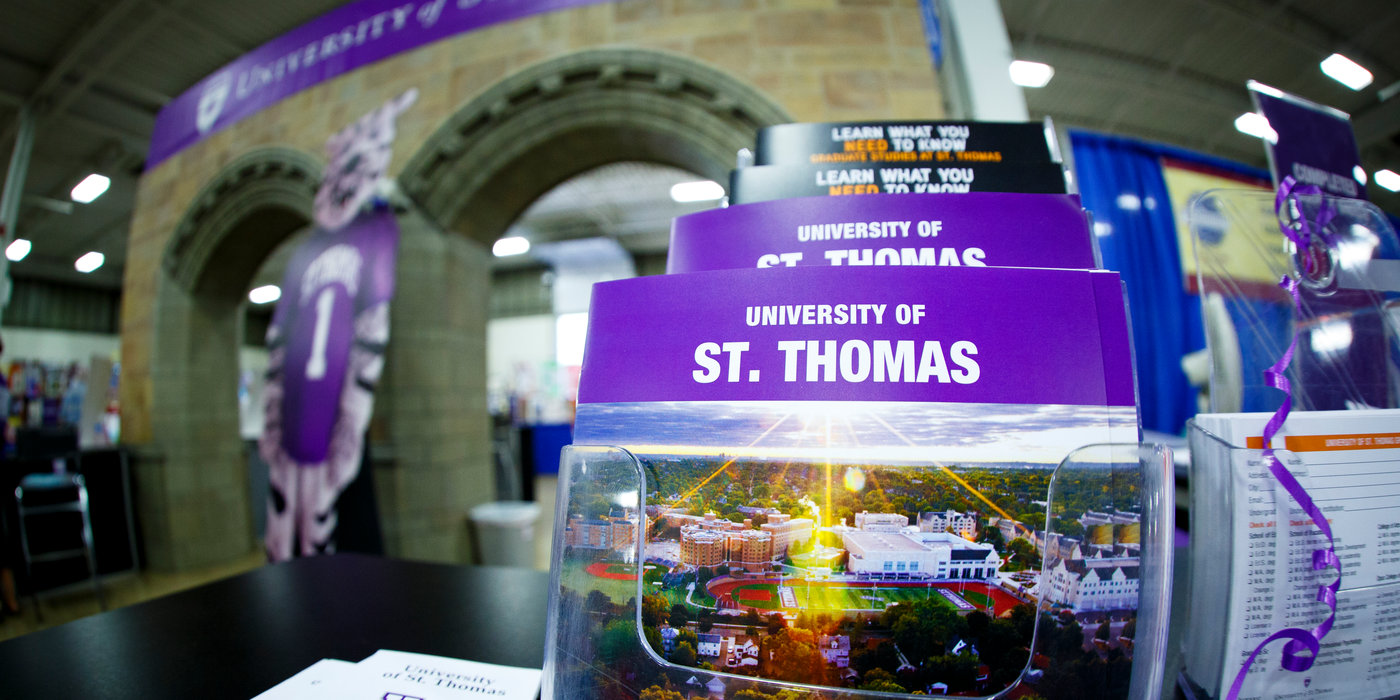 Promotional literature is shown at the university's Minnesota State Fair booth August 23, 2013. A pair of faux Arches is in the background.