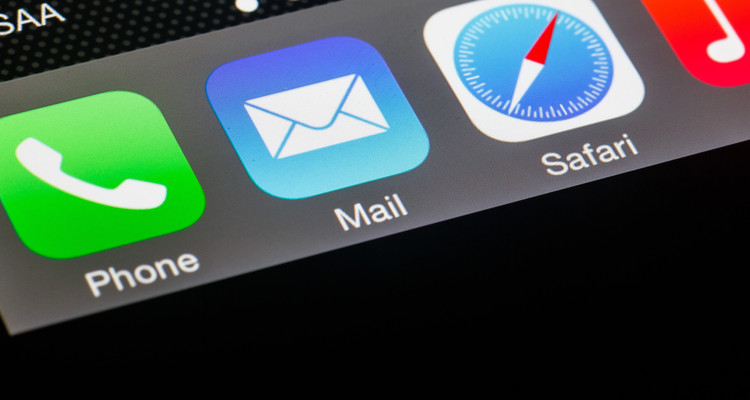 Mail, Safari, iTunes Music and other social media app (application) badges and icons glow on an iPhone 6 smartphone in a studio photo taken on January 13, 2015.