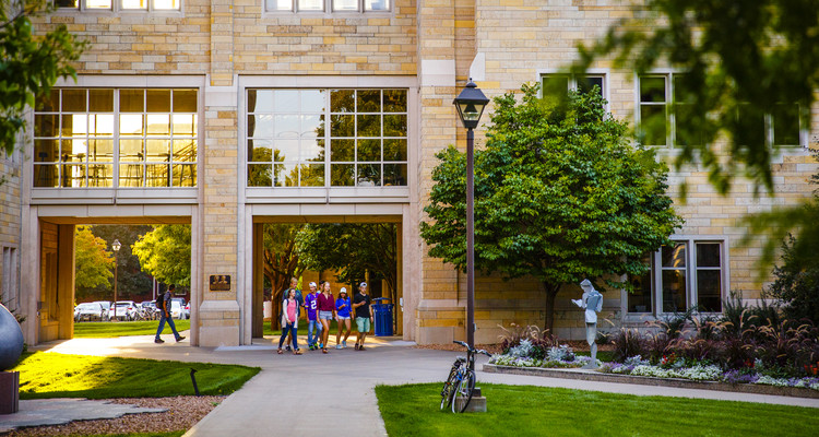 Students walk past O'Shaughnessy Science Hall and across Sabo Plaza September 14, 2015.