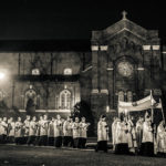 The procession started off past the Chapel of St. Thomas Aquinas and across the upper quad.