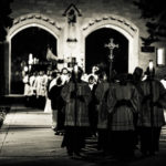 A procession of seminarians passes through The Arches for Borromeo Weekend.