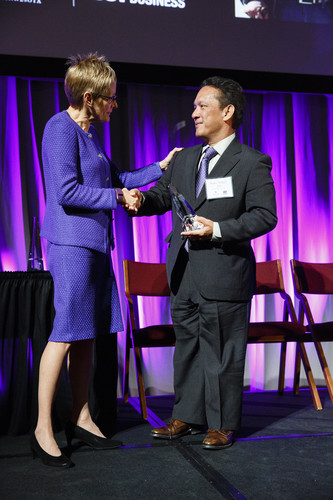 Pedro "Sonny" Ada, president of Ada's Trust and Investment, located in Guam, receives the Family Business award from UST President Dr. Julie Sullivan during the 2015 Entrepreneurship Awards gala in the Schulze Grand Atrium in the School of Law building in downtown Minneapolis on November 19, 2015.