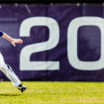 Jimmy Dolan dives for a fly ball in the outfield.