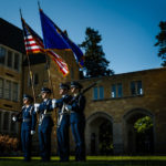 The Air Force ROTC color guard poses by The Arches.