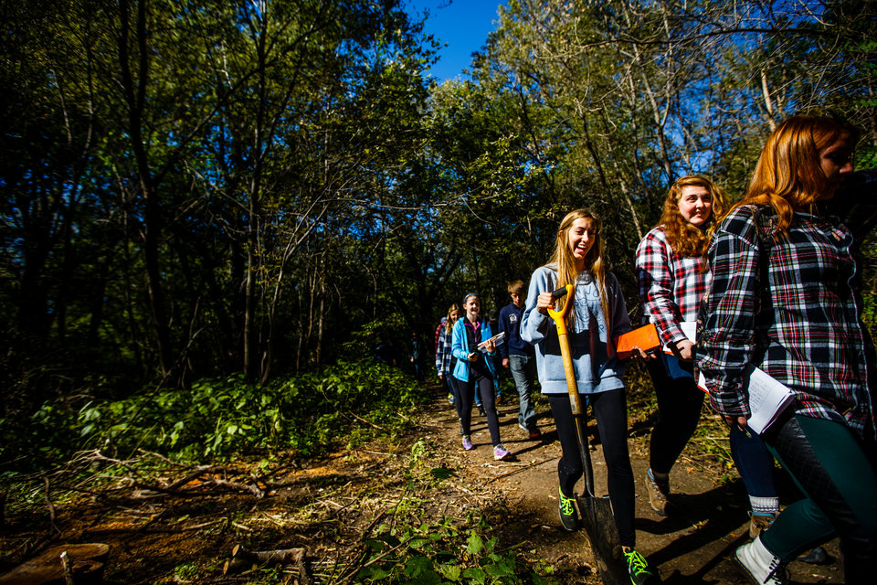 Students walk through Hidden Falls Park.