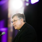 Vice president for mission Fr. Larry Snyder speaks at the brand launch event.