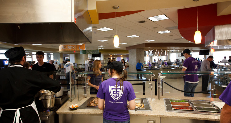 Dining services employees work at the "Your Call" action station in The View dining area in the Anderson Student Center March 27, 2012 .