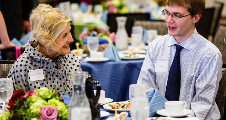 Student Matthew Anderson (right) chats with donor Joanne Hense during the Scholarship Spotlight Event May 7, 2015 in the Anderson Student Center's Woulfe Alumni Hall. The annual event brings together donors and scholarship recipients for a lunch and program.