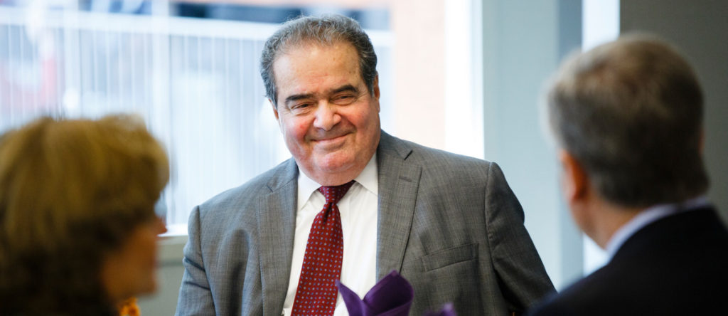 Supreme Court Justice Antonin Scalia smiles while having lunch at the School of Law building in downtown Minneapolis on October 20, 2015.