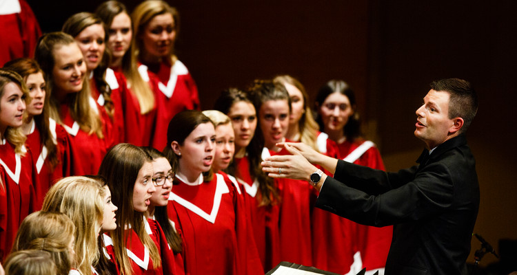 Conductor Aaron Brown leads the Liturgical Choir during a dress rehearsal for the St. Thomas Christmas Concert December 6, 2015 at Orchestra Hall in Minneapolis.