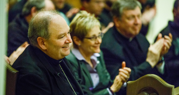 Archbishop-designate for St. Paul and Minneapolis Bernard Hebda smiles after speaking at the Tommie Catholic event in the Chapel of St. Thomas Aquinas April 19, 2016. Hebda delivered a keynote address on Pope Francis and Catholic Leadership before fielding questions from students. President Julie Sullivan is at center.